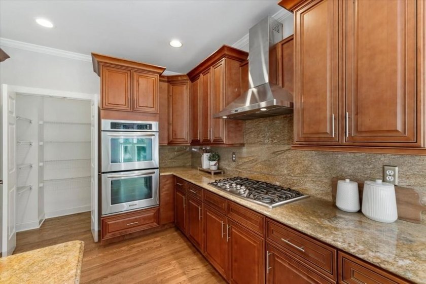 Welcome home to this stunning brick traditional nestled in the - photo 26