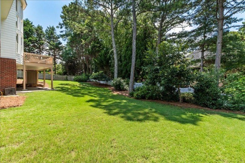 Welcome home to this stunning brick traditional nestled in the - photo 32