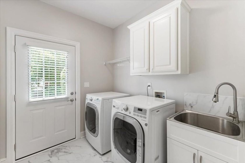 Welcome home to this stunning brick traditional nestled in the - photo 33