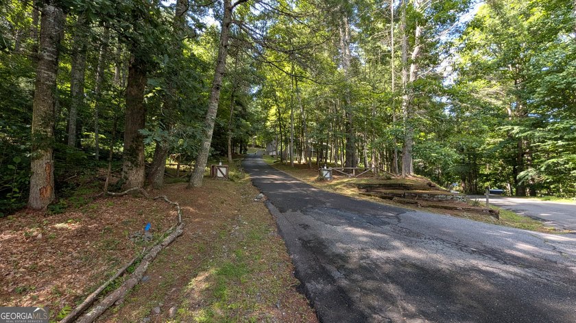 Welcome to 5302 Summerwood Lane, a very private home set high - photo 4