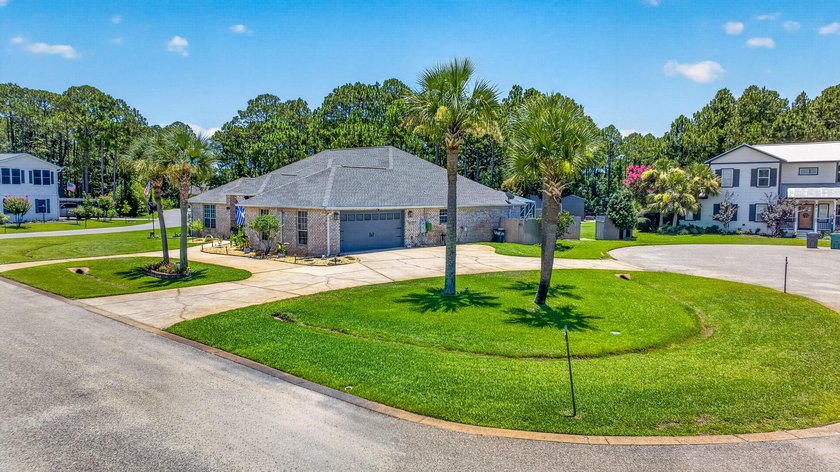 Nestled on a .54 acre corner cul-de-sac lot in the gated - photo 4