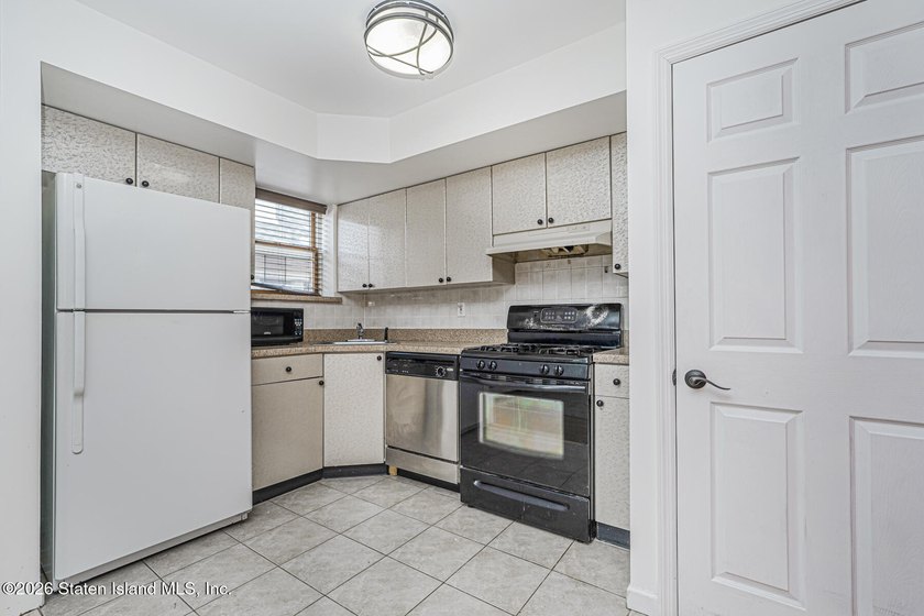 Welcome to this well-maintained 2-bedroom, 1.5-bath condo in the - photo 14
