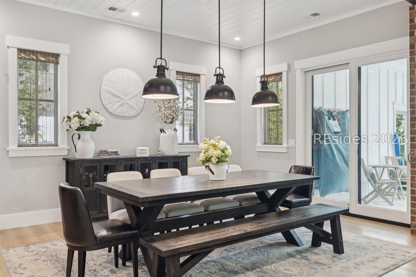 Step into a truly exceptional marshfront retreat where modern - photo 10