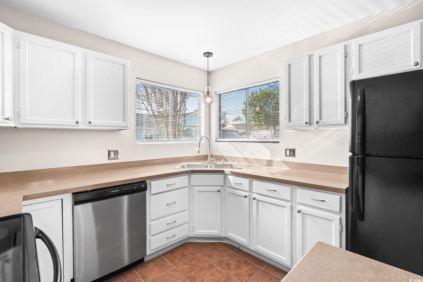 This charming three-bedroom, two-bathroom patio home is located - photo 11