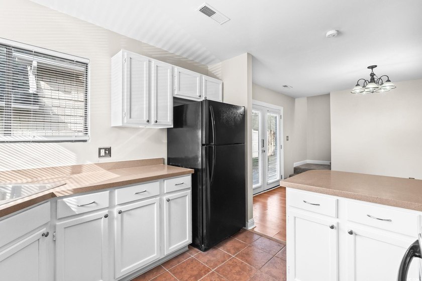 This charming three-bedroom, two-bathroom patio home is located - photo 14