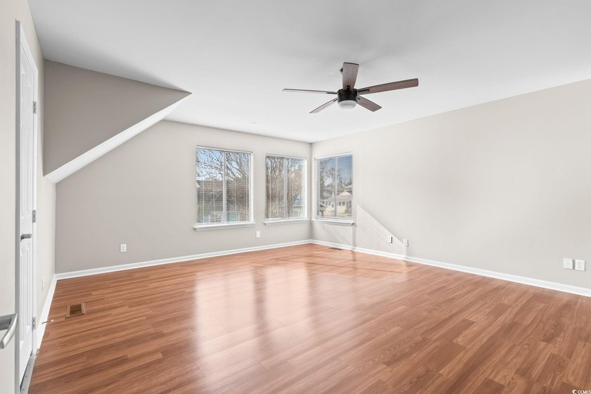 This charming three-bedroom, two-bathroom patio home is located - photo 22