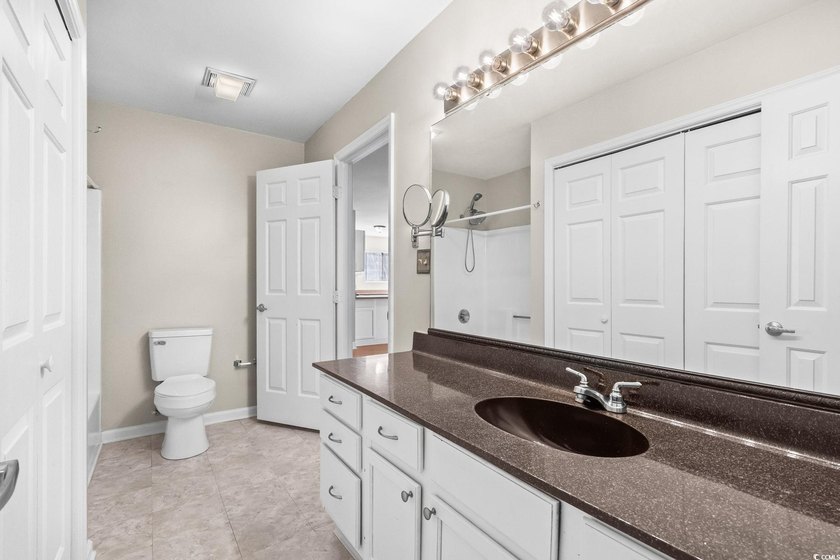 This charming three-bedroom, two-bathroom patio home is located - photo 30