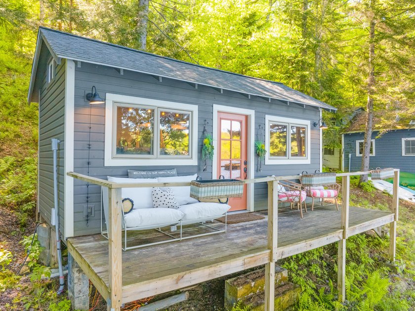 Set along approximately 150 feet of pristine shoreline on the - photo 5