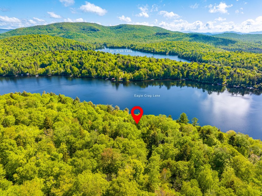 Set along approximately 150 feet of pristine shoreline on the - photo 8