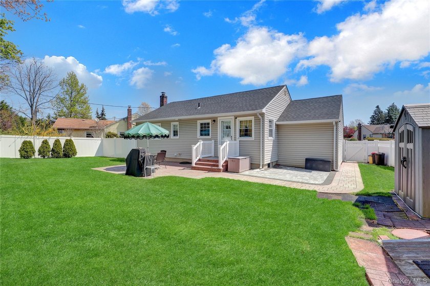 This beautifully maintained ranch offers the perfect blend of - photo 18
