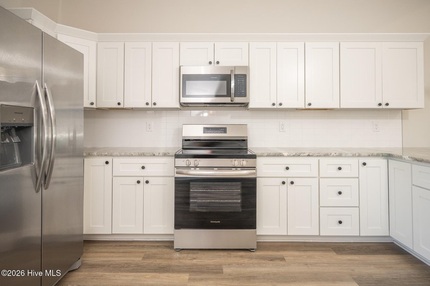 New construction home featuring 3 bedrooms and 2 bathrooms with - photo 11