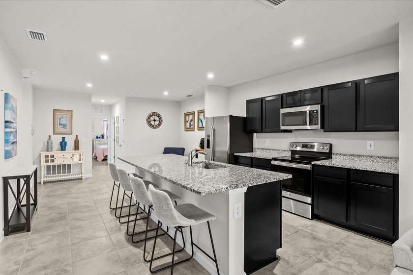 Welcome to this charming 3-bedroom, 2-bath villa in Avalon - photo 12