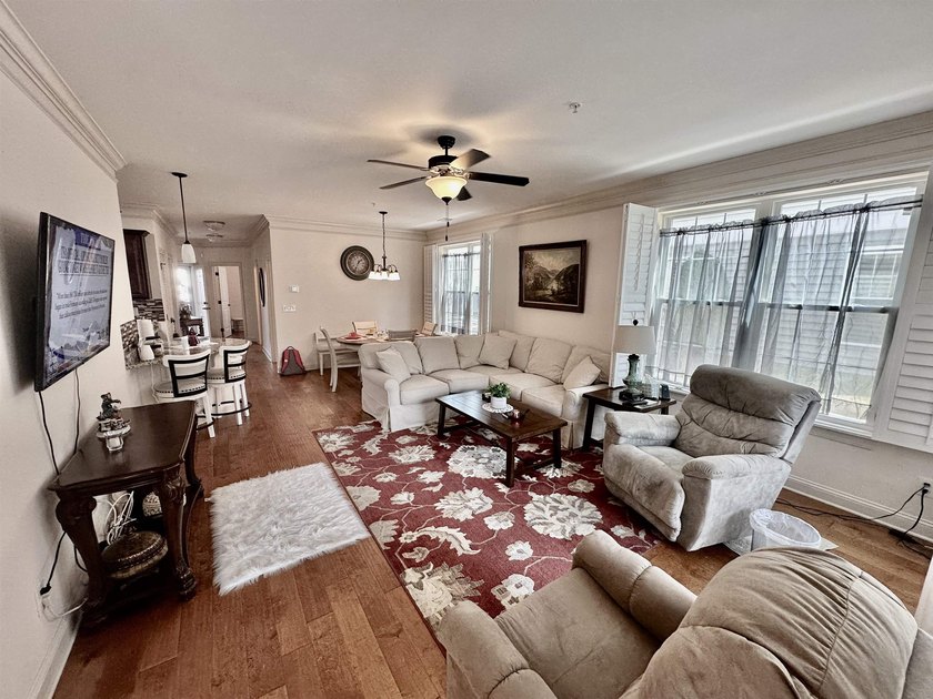 Welcome to this elegant three-bedroom, two-bathroom condominium - photo 4