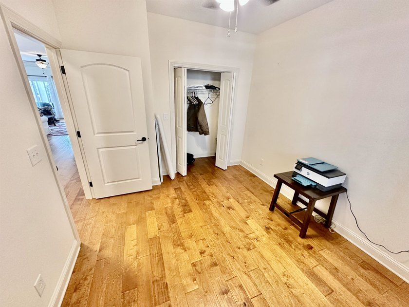 Welcome to this elegant three-bedroom, two-bathroom condominium - photo 9