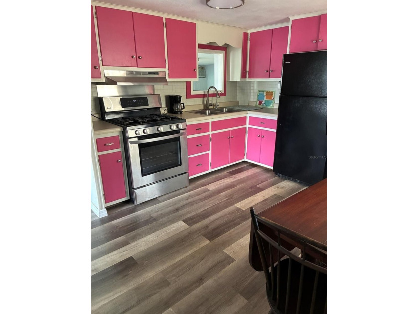 This home is located in a 55+ Community.   Situated on the Chain - photo 8
