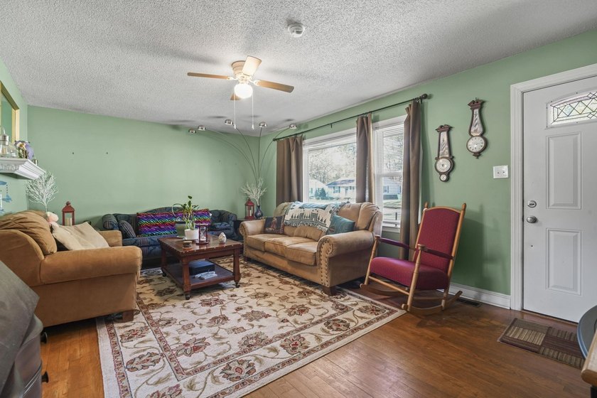 Charming 4-bedroom home situated on a spacious corner lot shaded - photo 3