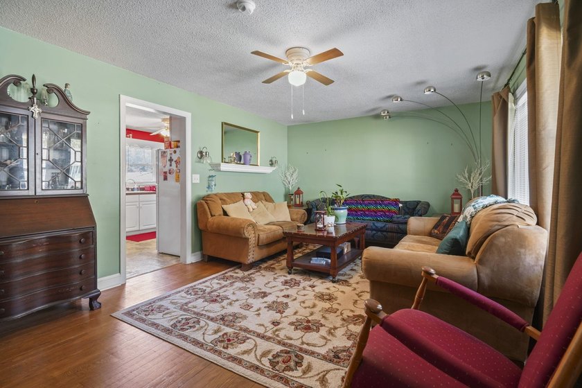 Charming 4-bedroom home situated on a spacious corner lot shaded - photo 4