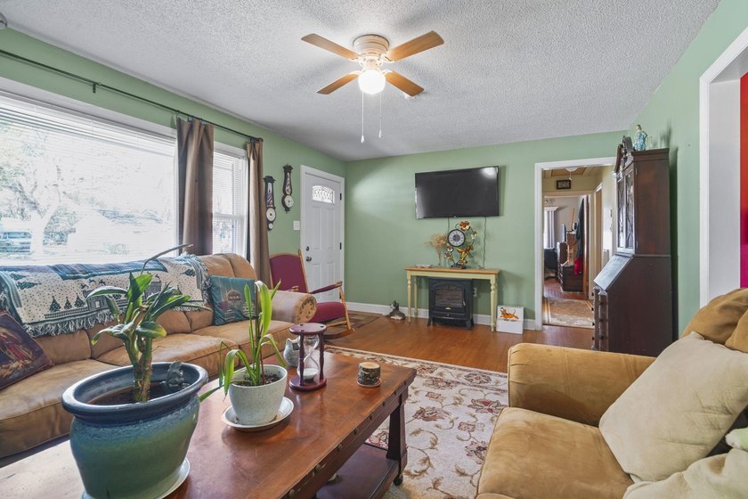 Charming 4-bedroom home situated on a spacious corner lot shaded - photo 5