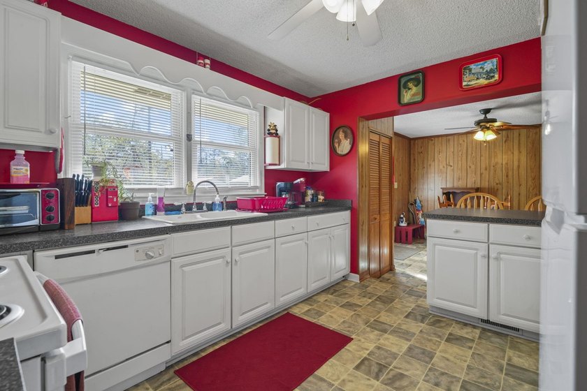 Charming 4-bedroom home situated on a spacious corner lot shaded - photo 6
