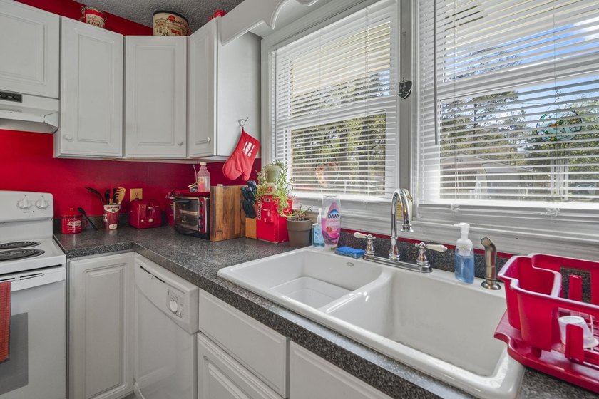 Charming 4-bedroom home situated on a spacious corner lot shaded - photo 7