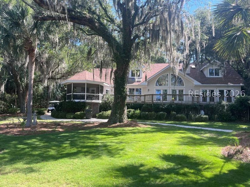 Set against a breathtaking Lowcountry backdrop, this stately - photo 4