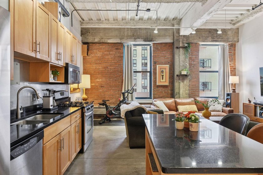 Welcome to this stunning one bedroom + den condo at the historic - photo 3
