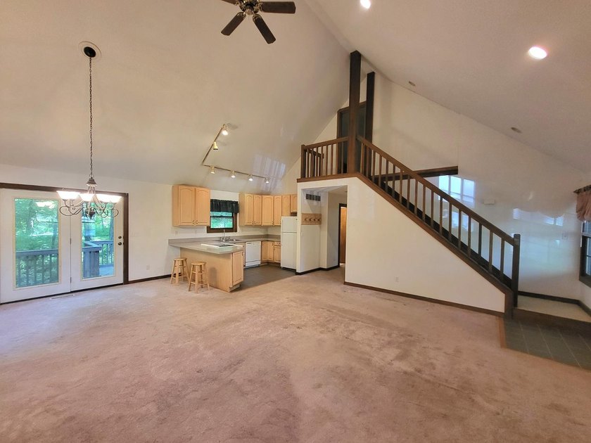 Cabin vibes, wooded views, extra lot, under $300,000.00. Located - photo 5
