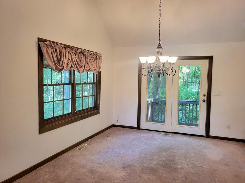 Cabin vibes, wooded views, extra lot, under $300,000.00. Located - photo 8