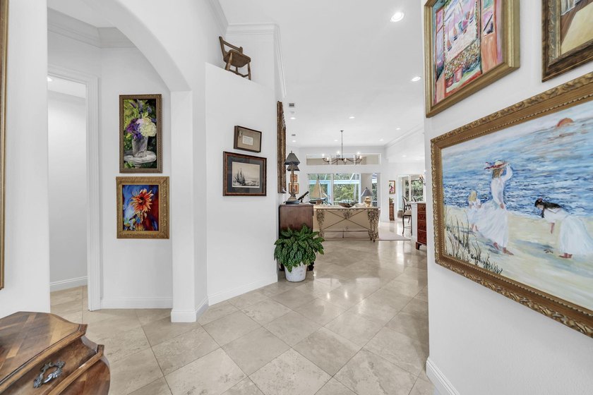 Welcome to luxury, low-maintenance living in the prestigious - photo 6