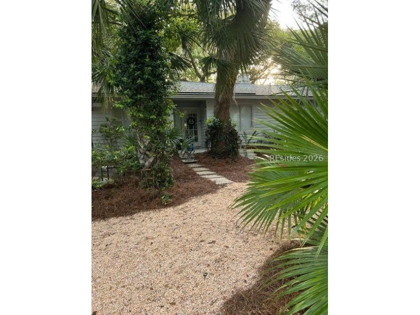 This charming two-bedroom, two-bathroom home is nestled in the - photo 2