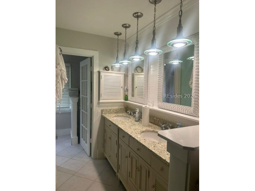 This charming two-bedroom, two-bathroom home is nestled in the - photo 7