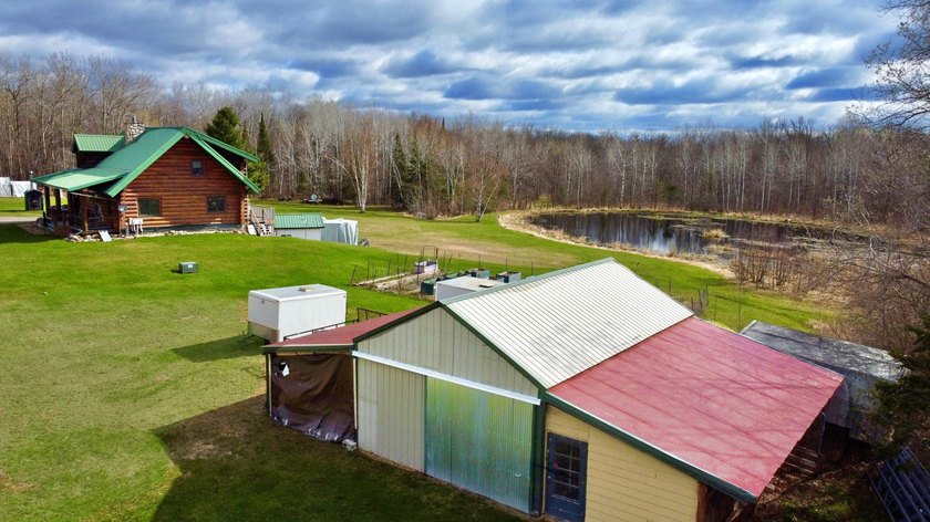 Authentic log cabin retreat on 80 picturesque acres featuring a - photo 12
