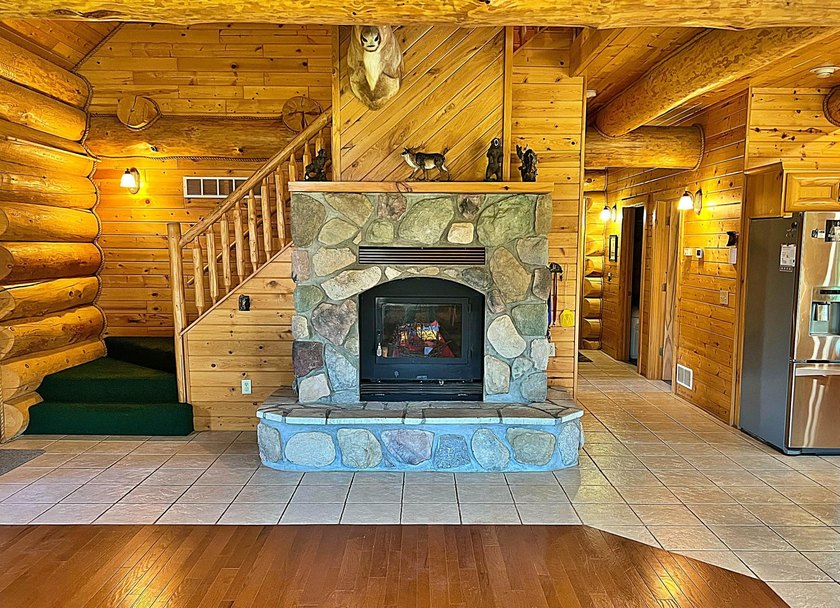 Authentic log cabin retreat on 80 picturesque acres featuring a - photo 16