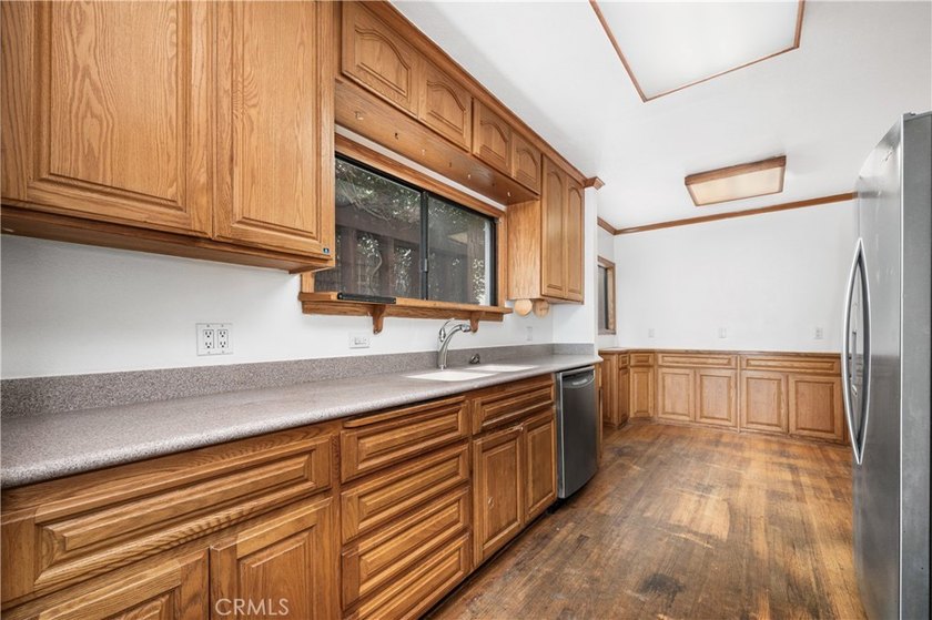 This 1924 low profile Spanish bungalow is located in one of the - photo 17