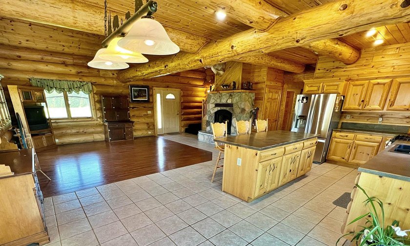 Authentic log cabin retreat on 80 picturesque acres featuring a - photo 17