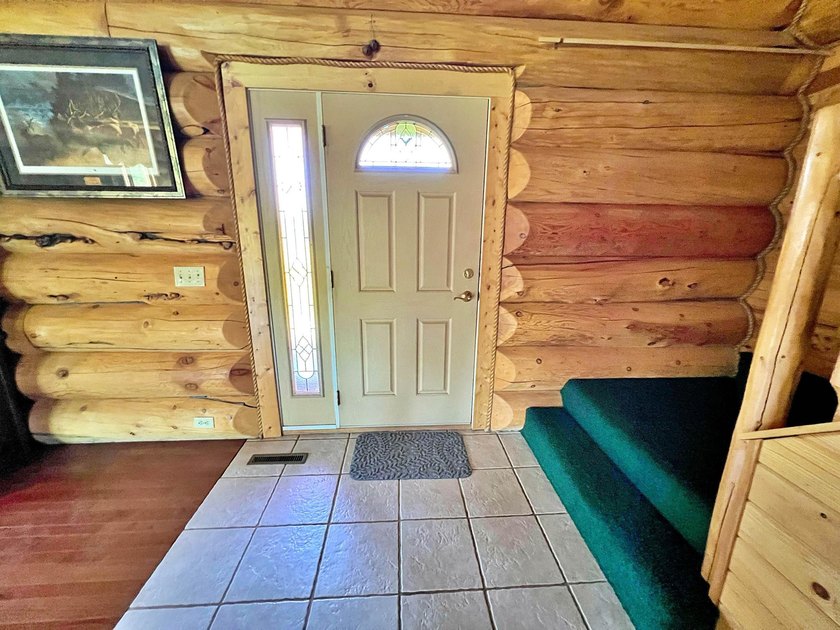 Authentic log cabin retreat on 80 picturesque acres featuring a - photo 19