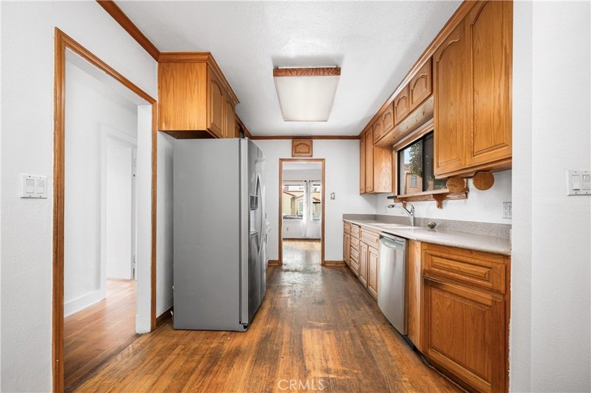 This 1924 low profile Spanish bungalow is located in one of the - photo 20