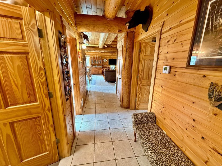 Authentic log cabin retreat on 80 picturesque acres featuring a - photo 20