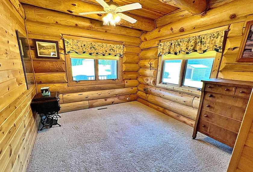 Authentic log cabin retreat on 80 picturesque acres featuring a - photo 22