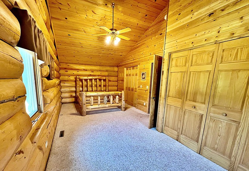 Authentic log cabin retreat on 80 picturesque acres featuring a - photo 24