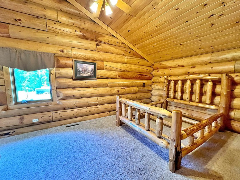 Authentic log cabin retreat on 80 picturesque acres featuring a - photo 25