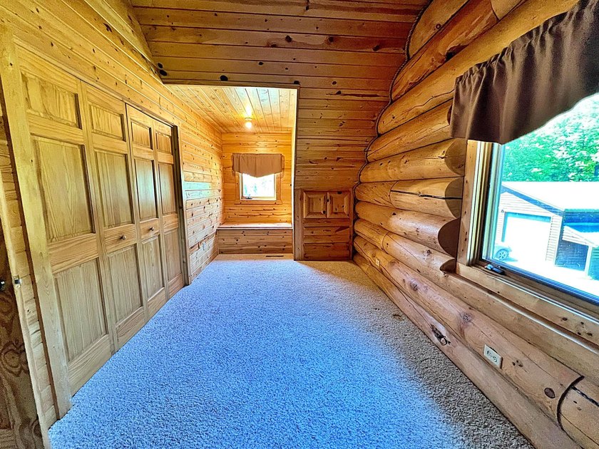 Authentic log cabin retreat on 80 picturesque acres featuring a - photo 27