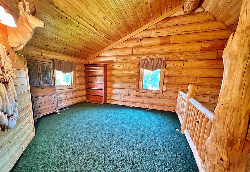 Authentic log cabin retreat on 80 picturesque acres featuring a - photo 31