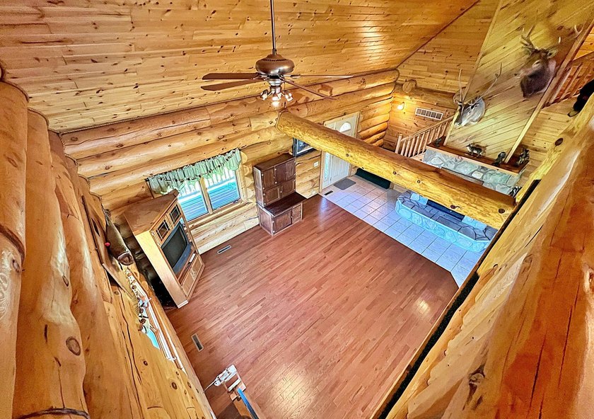 Authentic log cabin retreat on 80 picturesque acres featuring a - photo 33