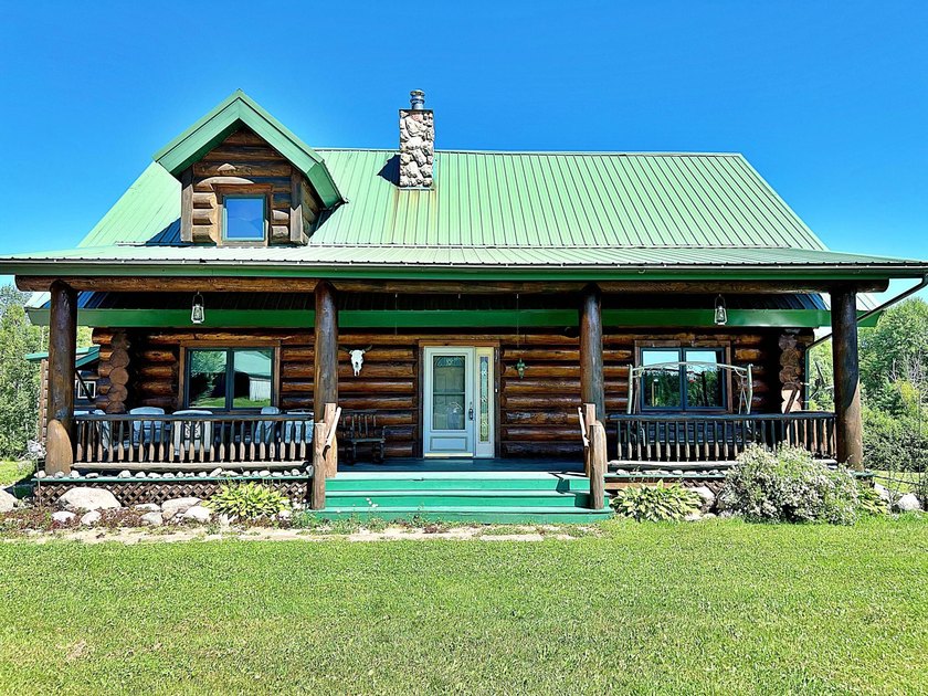 Authentic log cabin retreat on 80 picturesque acres featuring a - photo 41