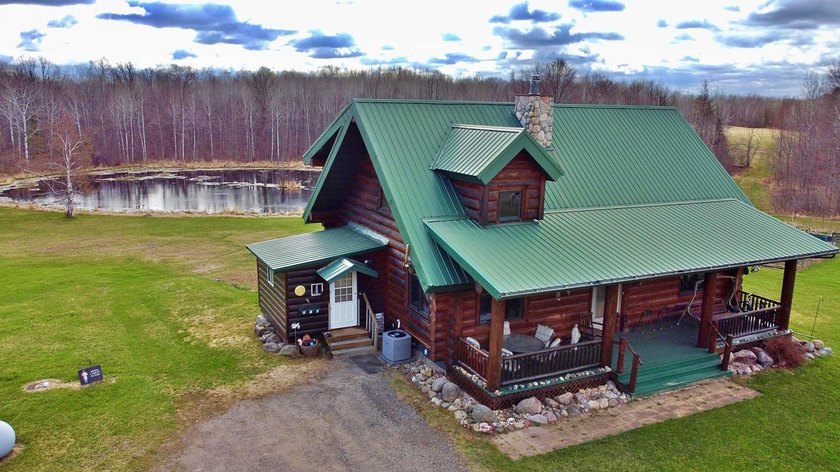 Authentic log cabin retreat on 80 picturesque acres featuring a - photo 46