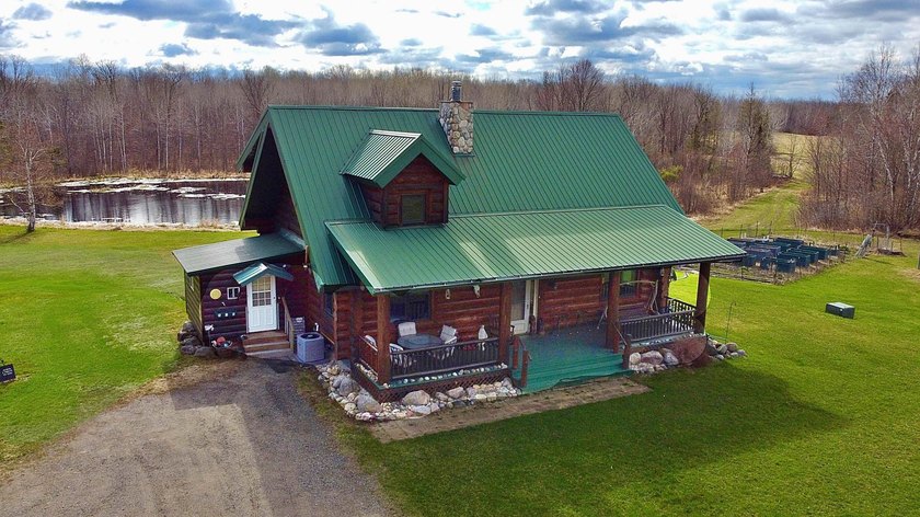 Authentic log cabin retreat on 80 picturesque acres featuring a - photo 47