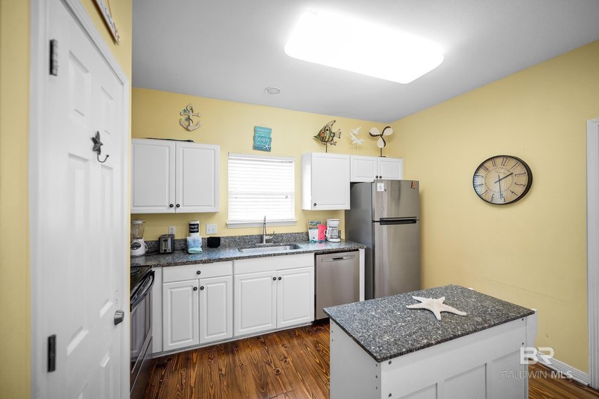 This beautifully maintained 3-bedroom, 2-bath cottage offers the - photo 17