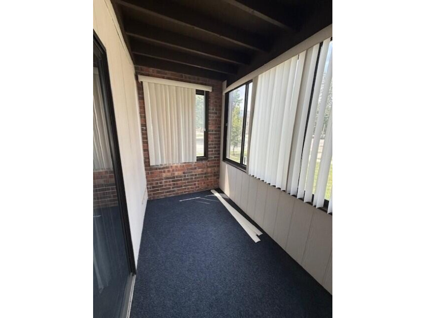 Main floor condo with enclosed patio on the north side of the - photo 12