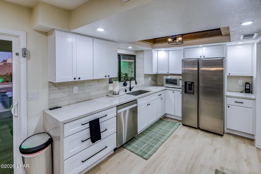 Completely remodeled and loaded with upgrades, this stunning 3 - photo 14